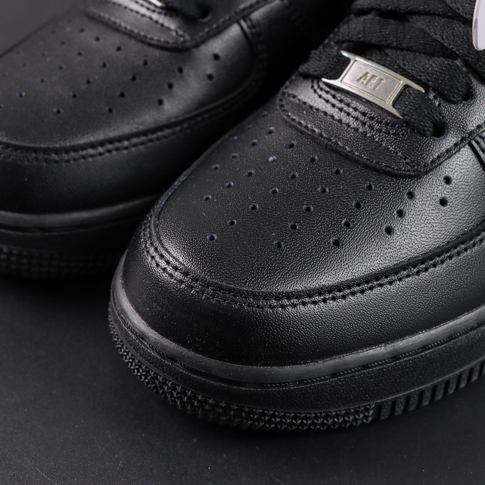 Close-up of Nike Air Force 1 ’07 “Triple Black” toe box highlighting perforations and leather texture.