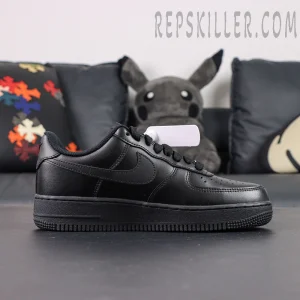 Side profile of Nike Air Force 1 ’07 “Triple Black” showing sleek all-black leather upper and Swoosh logo.