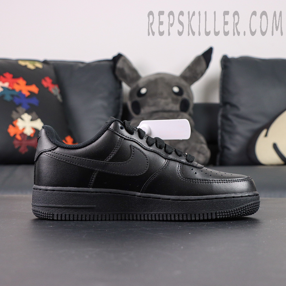 Side profile of Nike Air Force 1 ’07 “Triple Black” showing sleek all-black leather upper and Swoosh logo.