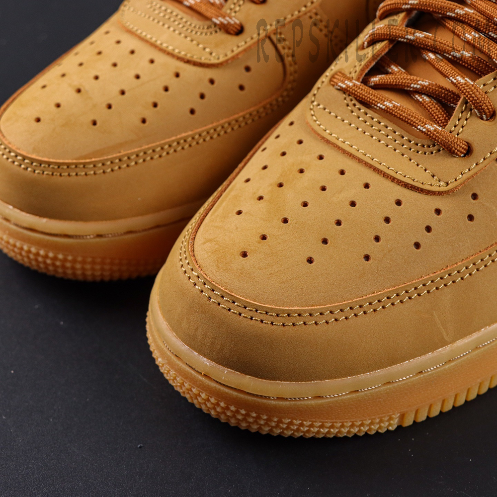 Close-up of Nike Air Force 1 Low ‘Flax’ 2019 toe box with perforated detailing and smooth stitching