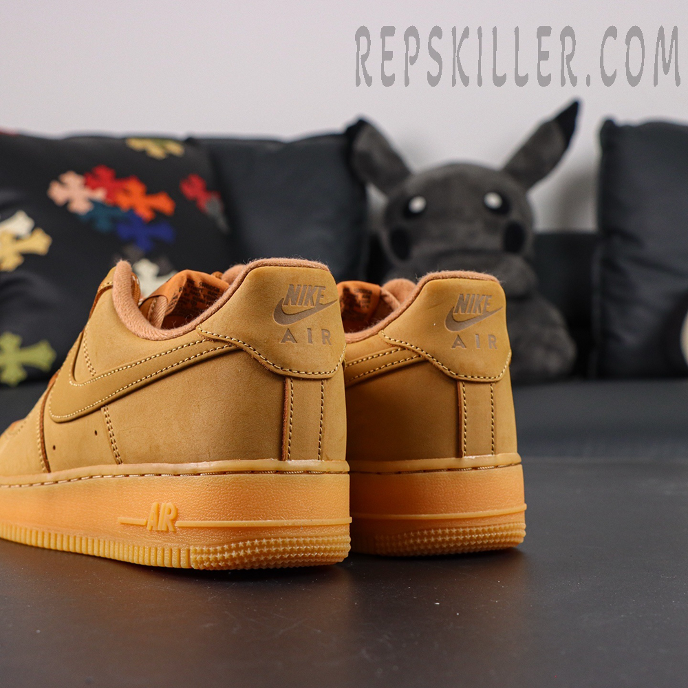 Rear view of Nike Air Force 1 Low ‘Flax’ 2019 with embossed Nike Air logo on heel tab