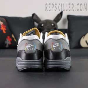 Rear view of Nike Air Max 1 “Low Poly - Big Head Mode” featuring multicolor NIKE AIR heel logo and gradient detailing.