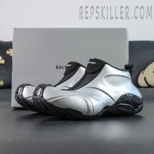 Angled view of Balenciaga Basketball Sneaker in Silver/Black placed in front of Balenciaga branded box.