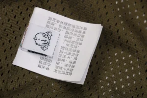 Bape × Saint Michael Co-Branded Tape Camo Jacket Wash label