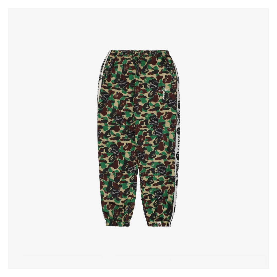 Bape × Saint Michael Collaborative Logo Tape Camo Track Pants Front view
