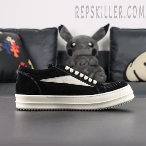 Side profile of DRKSHDW Hollywood Vintage Low “Black Milk” showing black upper with beige stripe and contrast stitching.