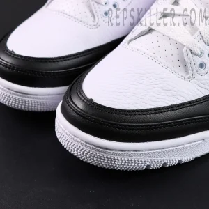 Close-up of Fragment Design x Air Jordan 3 “White” toe box showing white tumbled leather and black mudguard details.