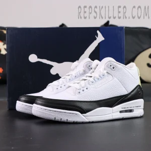 Fragment Design x Air Jordan 3 “White” with blue Jumpman box in background, featuring clean black-and-white colorway.