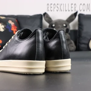 Rear angled view of Hollywood Low “Black Milk” showing smooth leather heel and layered midsole.