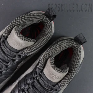 Top-down view of Air Jordan 10 Retro “Shadow” highlighting checkered inner lining and embossed tongue detail.