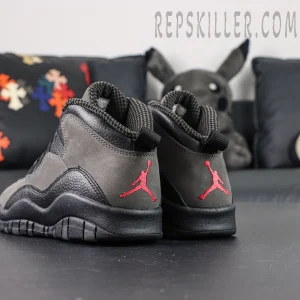 Angled rear view of Air Jordan 10 Retro “Shadow” featuring bold red Jumpman logo on heel.