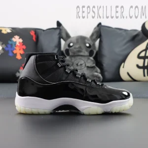 Full lateral side of Air Jordan 11 “Jubilee” showing black patent upper and translucent outsole.
