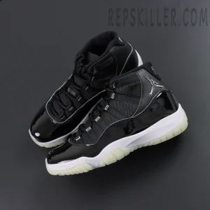 Top angle of Air Jordan 11 “Jubilee / 25th Anniversary” pair highlighting mesh tongue and metal Jumpman logo.