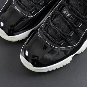 Toe box close-up of Air Jordan 11 “Jubilee” showing patent leather shine and clean stitch details.