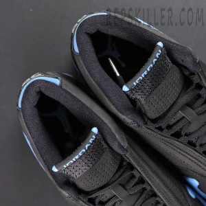 Top view of Air Jordan 14 “Black University Blue” showing padded collar and JORDAN branding on tongue.