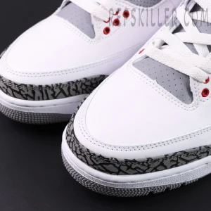 Close-up of Air Jordan 3 Retro “Fire Red” 2022 toe box showing elephant print overlay and smooth white leather.