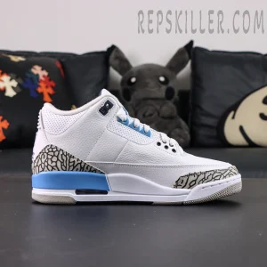 Side profile of Air Jordan 3 “UNC” showing tumbled white leather upper with elephant print overlays.