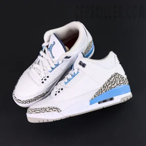 Overhead pair shot of Air Jordan 3 “UNC” sneakers highlighting elephant print details and University Blue accents.
