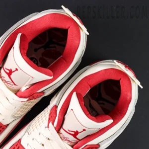 Overhead view of Air Jordan 4 Retro “Sierra Red” showing red Jumpman insoles and padded collar design.