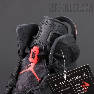 Air Jordan 6 Retro ‘Infrared’ 2019 — Close-up of tongue area with red Jumpman logo and lace lock.