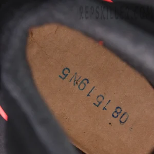 Jordan 6 “Reverse Infrared” Black / Light Crimson insole stamp detail showing production code marking.