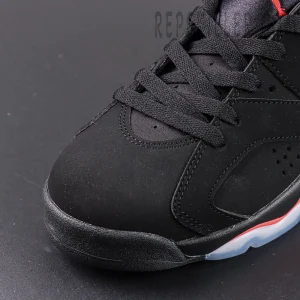 Air Jordan 6 “Reverse Infrared” — Close-up of black toe box with soft nubuck finish and red midsole accent.