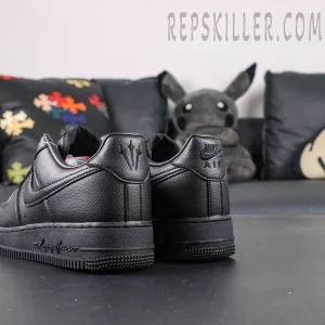 Angled rear view of NOCTA x Nike Air Force 1 “Certified Lover Boy” showing white leather construction and dual heel logos.