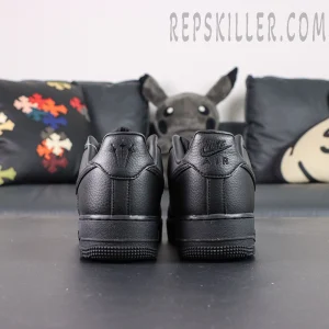 Rear view of NOCTA x Nike Air Force 1 “Certified Lover Boy” showing Nike Air and trident logos on heel tabs.