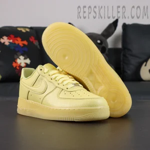 Outsole and side view of NOCTA x Air Force 1 “Citron Tint” showing circular traction pattern and engraved “Love You Forever” text.