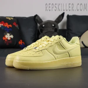 Angled front view of NOCTA x Nike Air Force 1 “Citron Tint” showing smooth yellow leather upper and classic Swoosh logo.