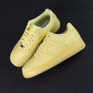 Overhead pair of NOCTA x Air Force 1 “Citron Tint” highlighting tonal yellow color and “Love You Forever” midsole detail.