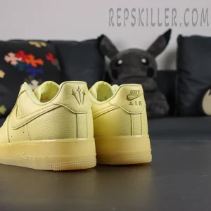 Rear angled view of NOCTA x Air Force 1 “Citron Tint” showing dual heel logos and soft leather texture.