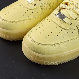 Close-up of NOCTA x Nike Air Force 1 “Citron Tint” toe box showing perforations and premium leather details.