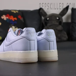 Rear angled view of NOCTA x Nike Air Force 1 “Palest Purple” with visible trident logo and “Love You Forever” engraving.