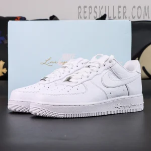 NOCTA x Nike Air Force 1 “Certified Lover Boy” with light blue box background showing elegant all-white design.