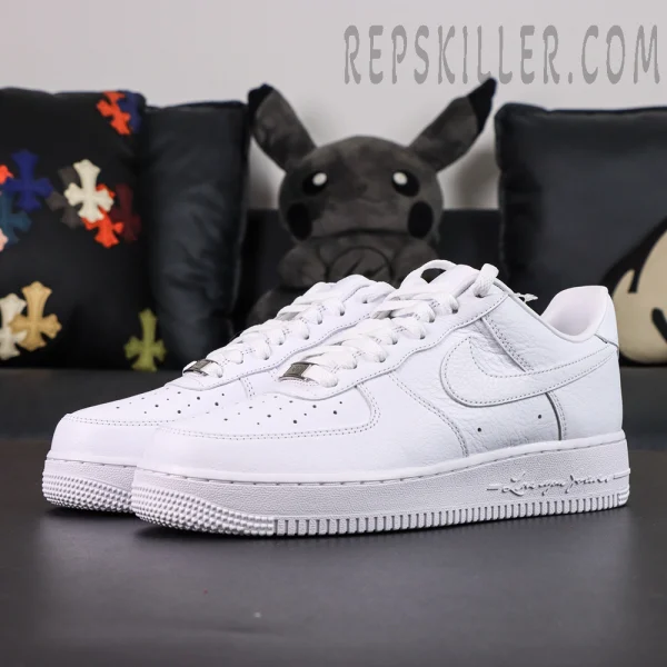 Side angle of NOCTA x Air Force 1 “Certified Lover Boy” showing clean leather upper and signature sole text “Love You Forever.”