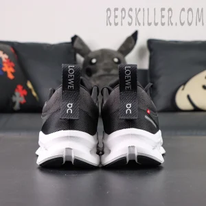 Rear view of ON L × Cloudtilt 2 “Black” showing dual pull tabs with LOEWE and On branding.