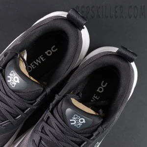 Overhead close-up of ON L × Cloudtilt 2 “Black” showing padded collar and LOEWE × On insole branding.