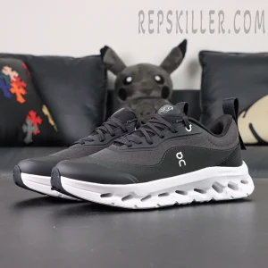 Outsole view of ON L × Cloudtilt 2 “Black” showing black rubber traction and white cushioning design.