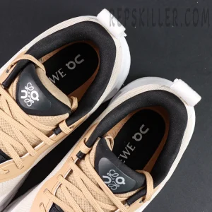 Overhead close-up of ON L × Cloudtilt 2 “Tan White” insoles with LOEWE × On co-branding.