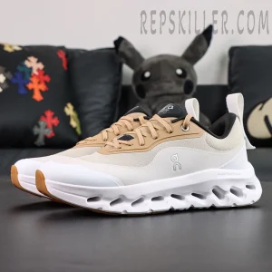 Side view of ON L × Cloudtilt 2 “Tan White” featuring beige overlays and lightweight white midsole.