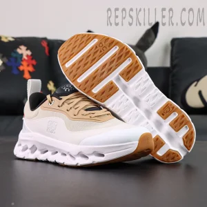 ON L × Cloudtilt 2 “Tan White” outsole view showing tan rubber traction and sculpted cushioning design.