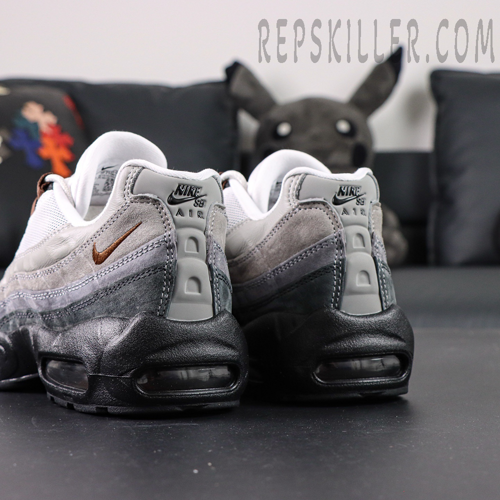 Rear angle of Nike SB x Air Max 95 “Cacao Wow” with gradient grey upper and bronze Swoosh embroidery.
