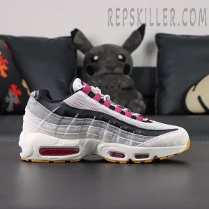 Side profile of Nike SB x Air Max 95 “Cactus Flower” showing layered white, grey, and black upper with pink lace loops.