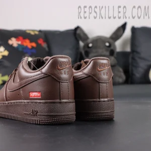 Rear heel view of Sup x Air Force 1 Low SP ‘Box Logo - Baroque Brown’ featuring embossed Nike Air logo and red Supreme patch