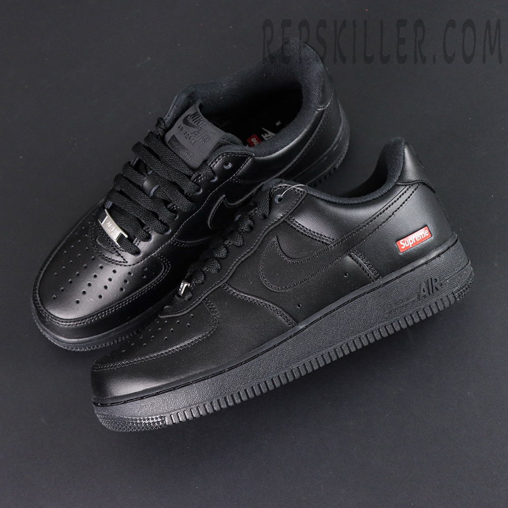 Overhead view of Sup x Air Force 1 Low SP ‘Box Logo - Black’ showcasing premium black leather upper and red Supreme tag