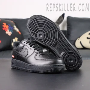 Bottom view of Sup x Air Force 1 Low SP ‘Box Logo - Black’ showing circular traction outsole and Nike Air text
