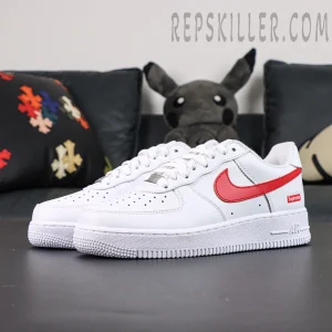 Side angle of Supreme x Nike Air Force 1 Low SP ‘Box Logo - Speed Red’ featuring red swoosh and white leather upper