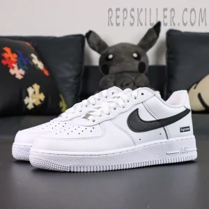 Side angle of Supreme x Nike Air Force 1 Low SP ‘Box Logo - White Black’ featuring black swoosh and white leather upper