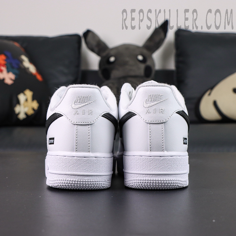 Rear heel close-up of Supreme x Nike Air Force 1 Low SP ‘Box Logo - White Black’ with dual Nike and Supreme branding